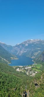 Scenic view of mountains against clear blue sky