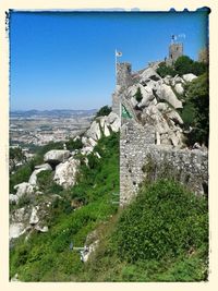 Castle on hill against sky