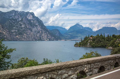 Scenic view of lake and mountains against sky at lake garda italy