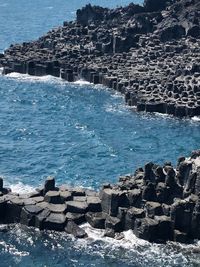 Scenic view of sea by rocks