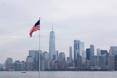 Flag with city in background