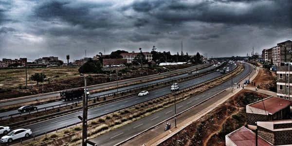High angle view of city against cloudy sky