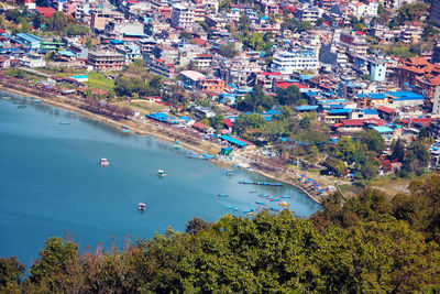 High angle view of buildings by sea