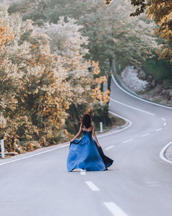 Rear view of woman standing in park