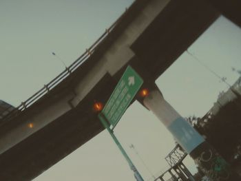 Low angle view of illuminated bridge against clear sky