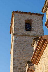 Low angle view of old building against clear sky