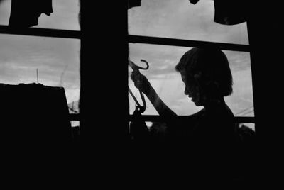 Silhouette of woman in dark background