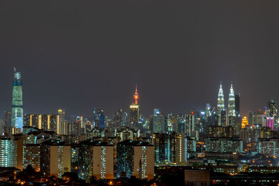 Illuminated buildings in city at night