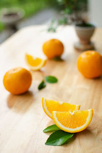 Fresh orange slices on wooden table