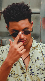 Portrait of young man wearing sunglasses