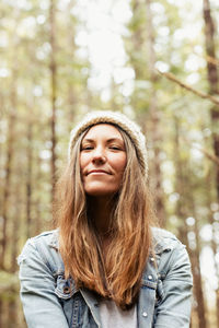 Beautiful woman forages in the rainforest near tofino