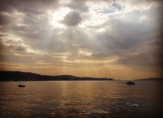 water, sky, nautical vessel, cloud - sky, sunset, scenics, sea, tranquil scene, transportation, tranquility, boat, waterfront, beauty in nature, mode of transport, cloudy, mountain, cloud, nature, silhouette, idyllic