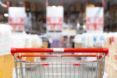 Close-up of red shopping cart in supermarket