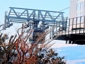 Low angle view of factory against sky