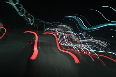 Abstract tones a night road and slow speed shutter light at highway