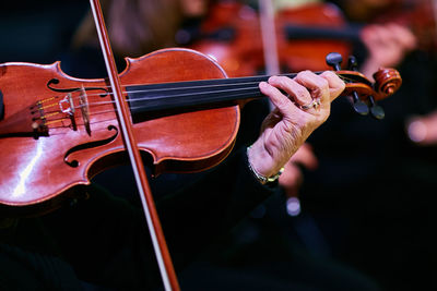 Cropped image of musician playing violin