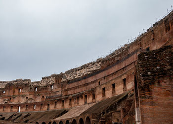 Low angle view of old ruin against sky