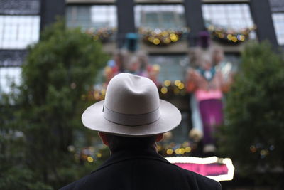 Rear view of woman wearing hat against sky