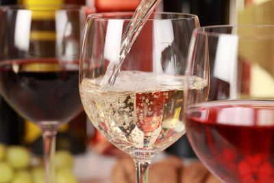 Close-up of wine in glass on table