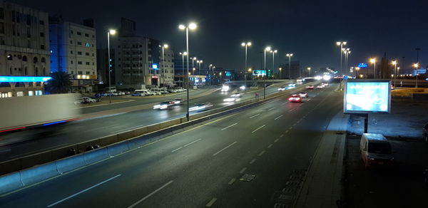 Light trails on road in city at night