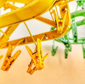 Close-up of yellow toy hanging on table