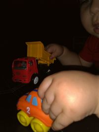 Boy playing with toy car