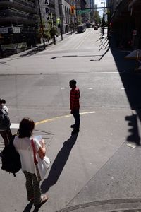 Girl standing on city street