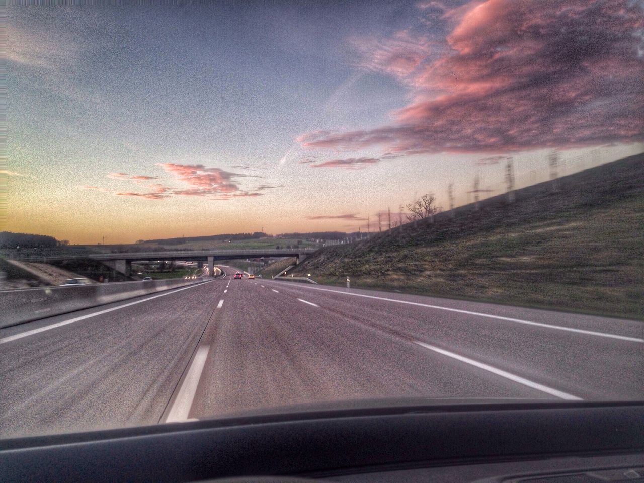 VIEW OF COUNTRY ROAD AT SUNSET