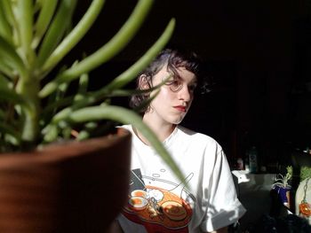 Portrait of a young woman sitting outdoors