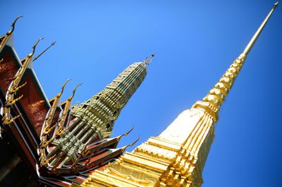 Low angle view of tower against clear blue sky