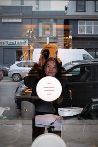 Portrait of woman with car on table