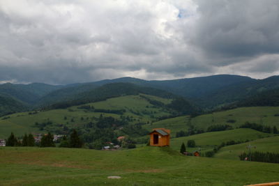 Scenic view of landscape and mountains against sky