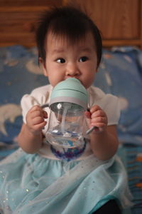 Close-up of boy drinking water