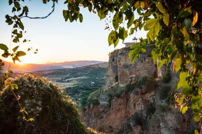 Scenic view of mountains against sky at sunset