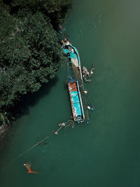 High angle view of man floating on lake