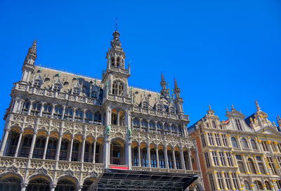 Low angle view of historical building against blue sky