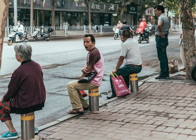 People standing on footpath