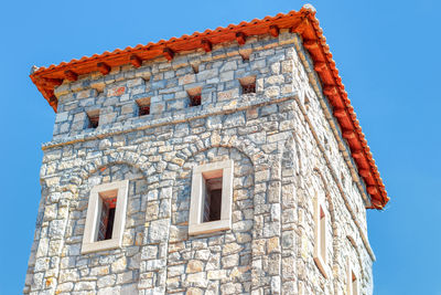 Architecture top part . belfry with brick wall