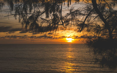 Scenic view of sea against romantic sky at sunset