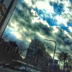 Low angle view of building against cloudy sky