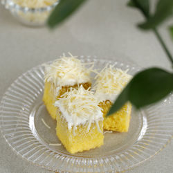 Slice chiffon cake with cream and shredded cheese, selected focus