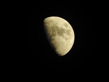 Low angle view of moon against clear sky at night