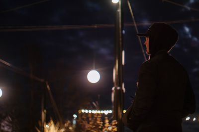 Man standing at night