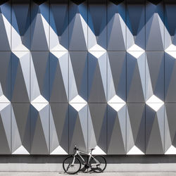 Bicycle against white wall