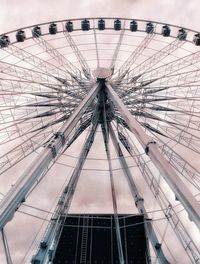 Low angle view of ferris wheel against sky