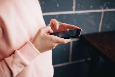 Close-up of hand holding smart phone