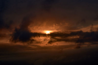 Low angle view of dramatic sky during sunset