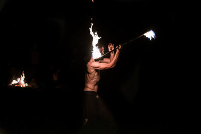 Man playing music in the dark