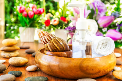 Close-up of purple flower vase on table