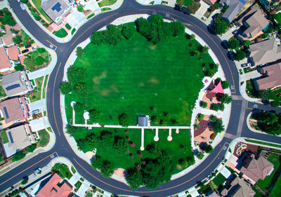 Directly above shot of road amidst houses in city